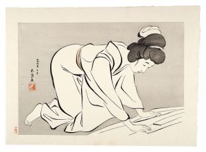 着物をたたむ女